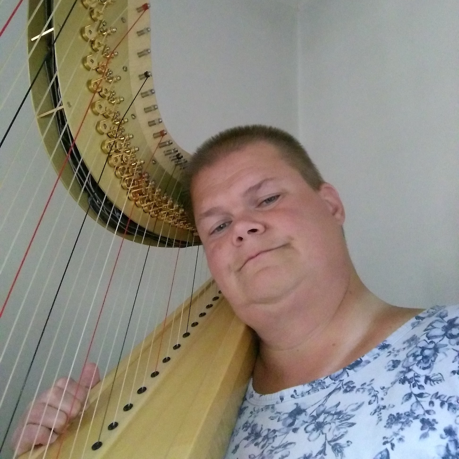 My own selfie showing me posing with Grover, my Camac Athena harp.